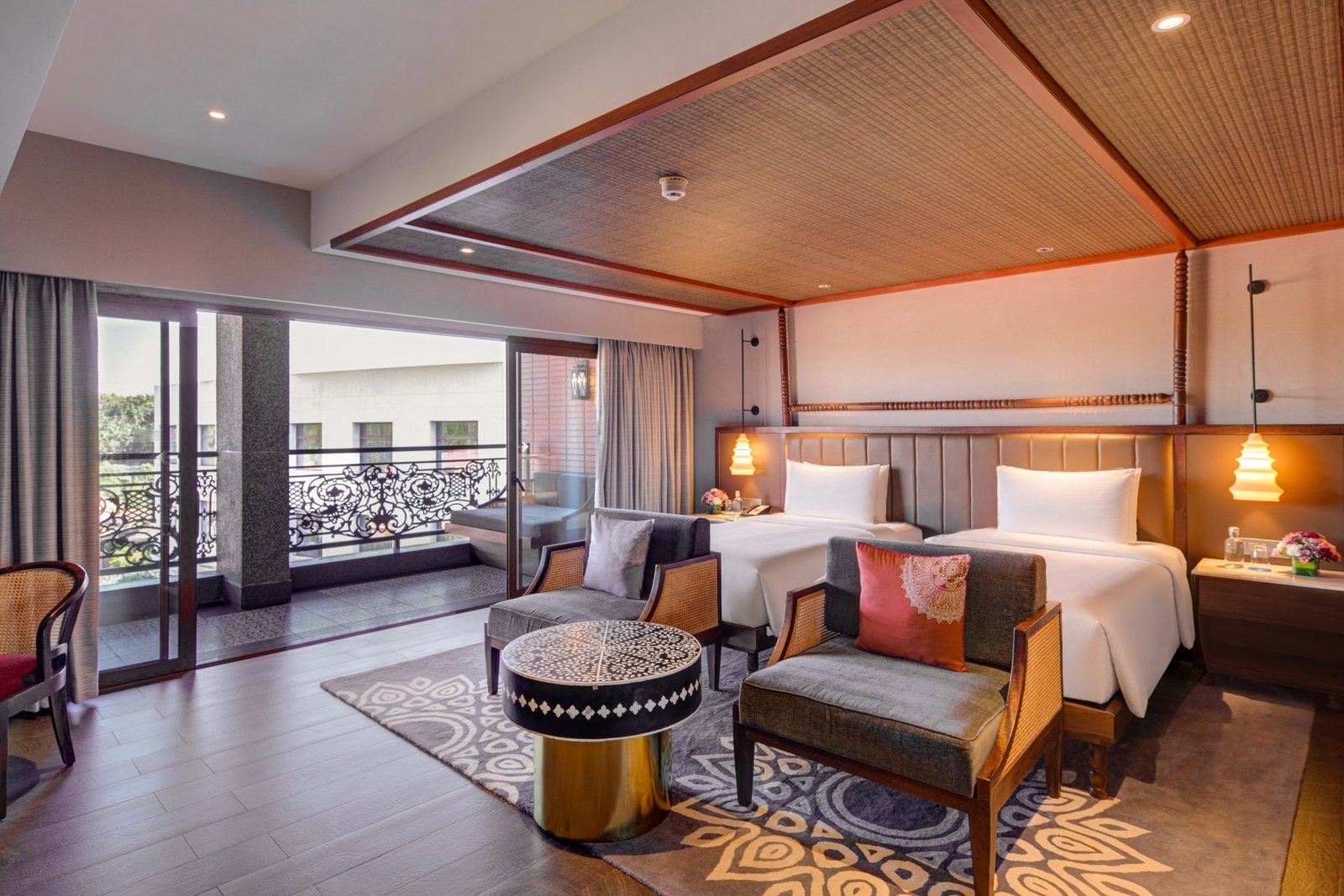 Contemporary hospitality suite with a timber ceiling and warm lighting
